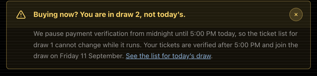 An amber warning above the buy form reading: Buying now? You are in draw 2, not today's. It explains that verification is paused from midnight until 5:00 PM so the list for draw 1 cannot change, and links to that list.